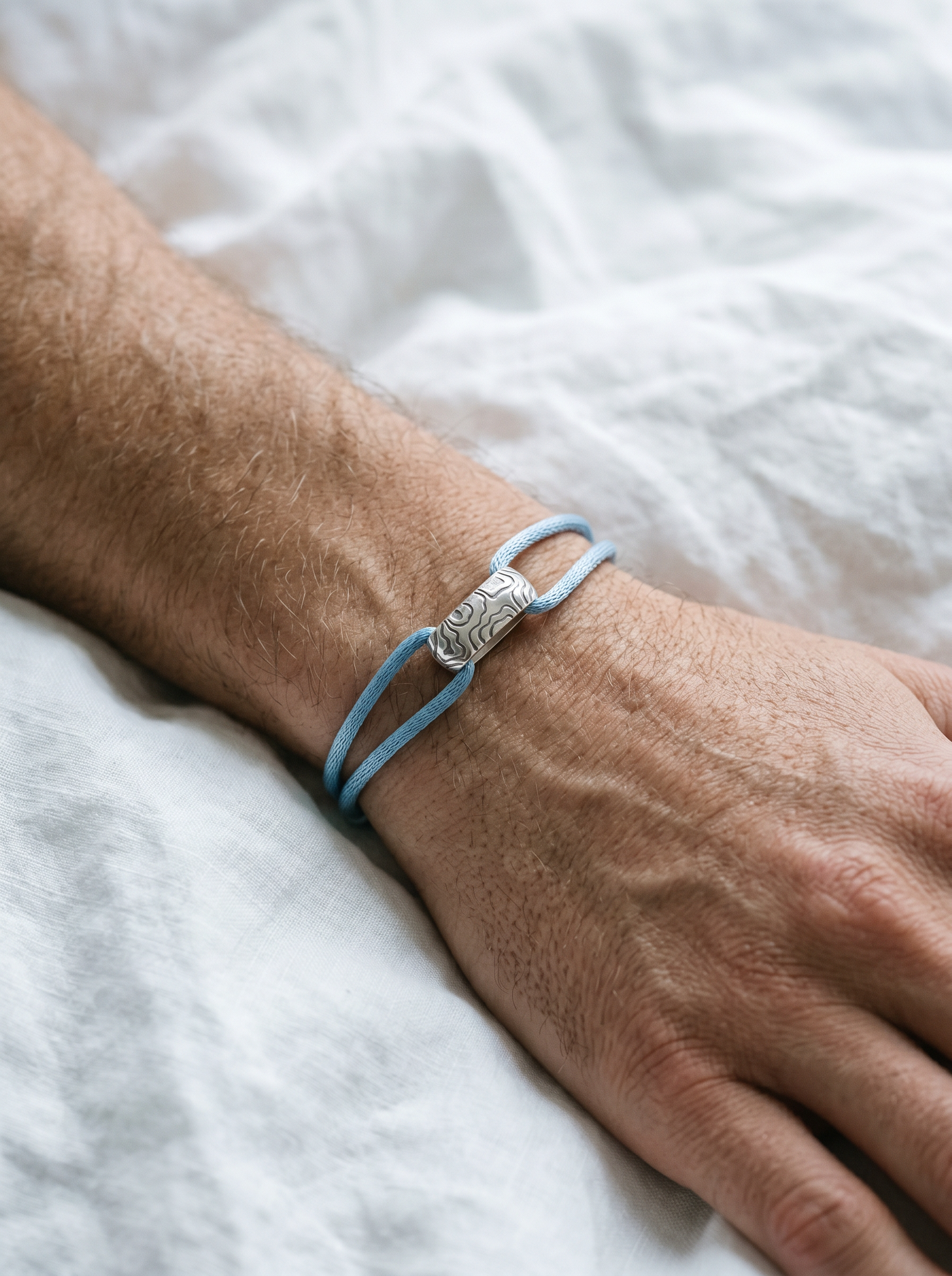 GRIT aqua cord on wrist